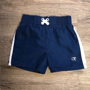 Op infant boys Blue and white swim trunks size 12m